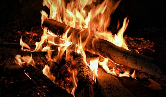 There is no one definitive answer to this question. The amount of heat produced by a fire burning wood will depend on a variety of factors, including the type of wood being burned,